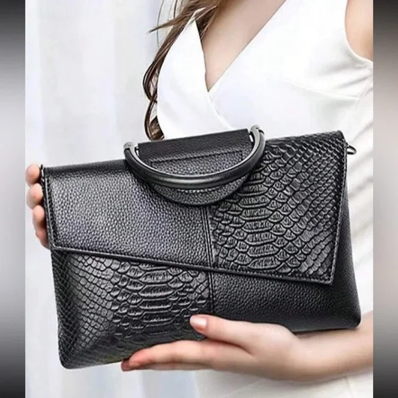 Black snakeskin print vegan leather clutchcrossbody bag
